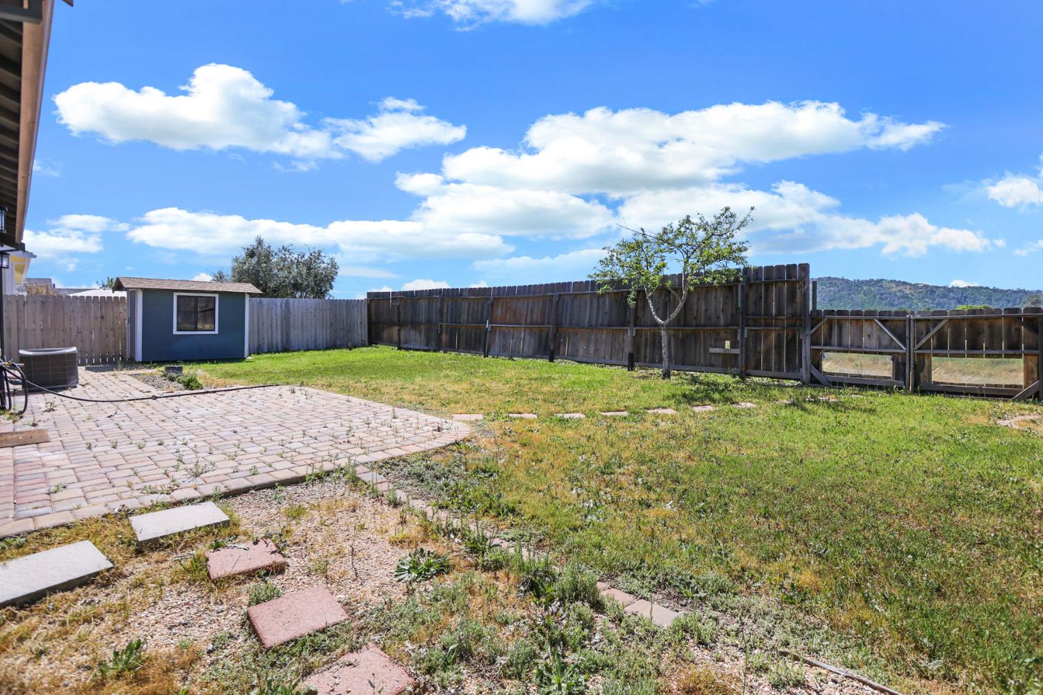 312 Copper Crest Drive Copperopolis, CA 95228 - Photo 10 of 38 a view of a backyard with a garden