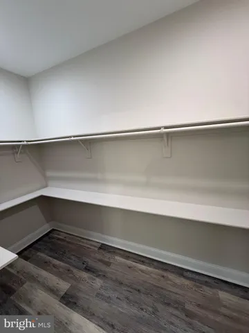 a wooden bench sitting next to a lake