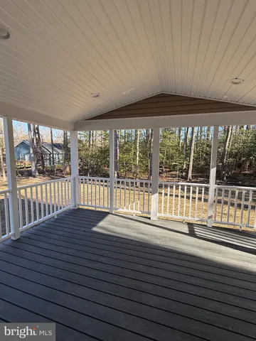 a view of wooden floor and a window