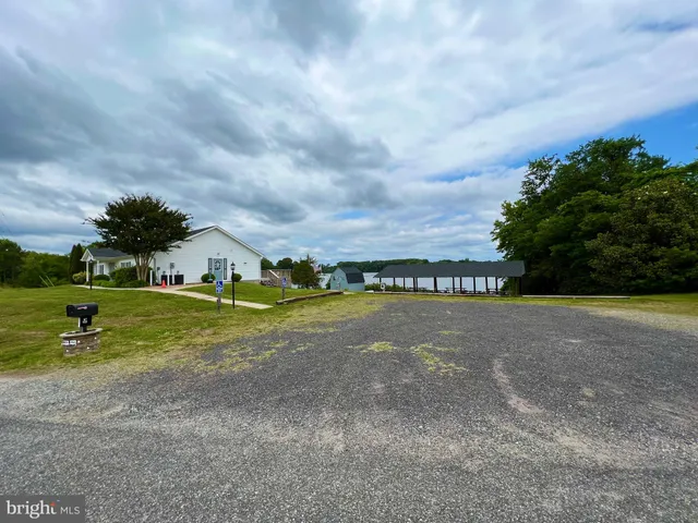 a view of a lake with a house in the background