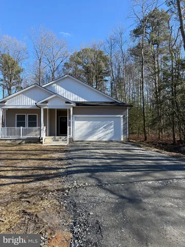 a view of a house with a garden