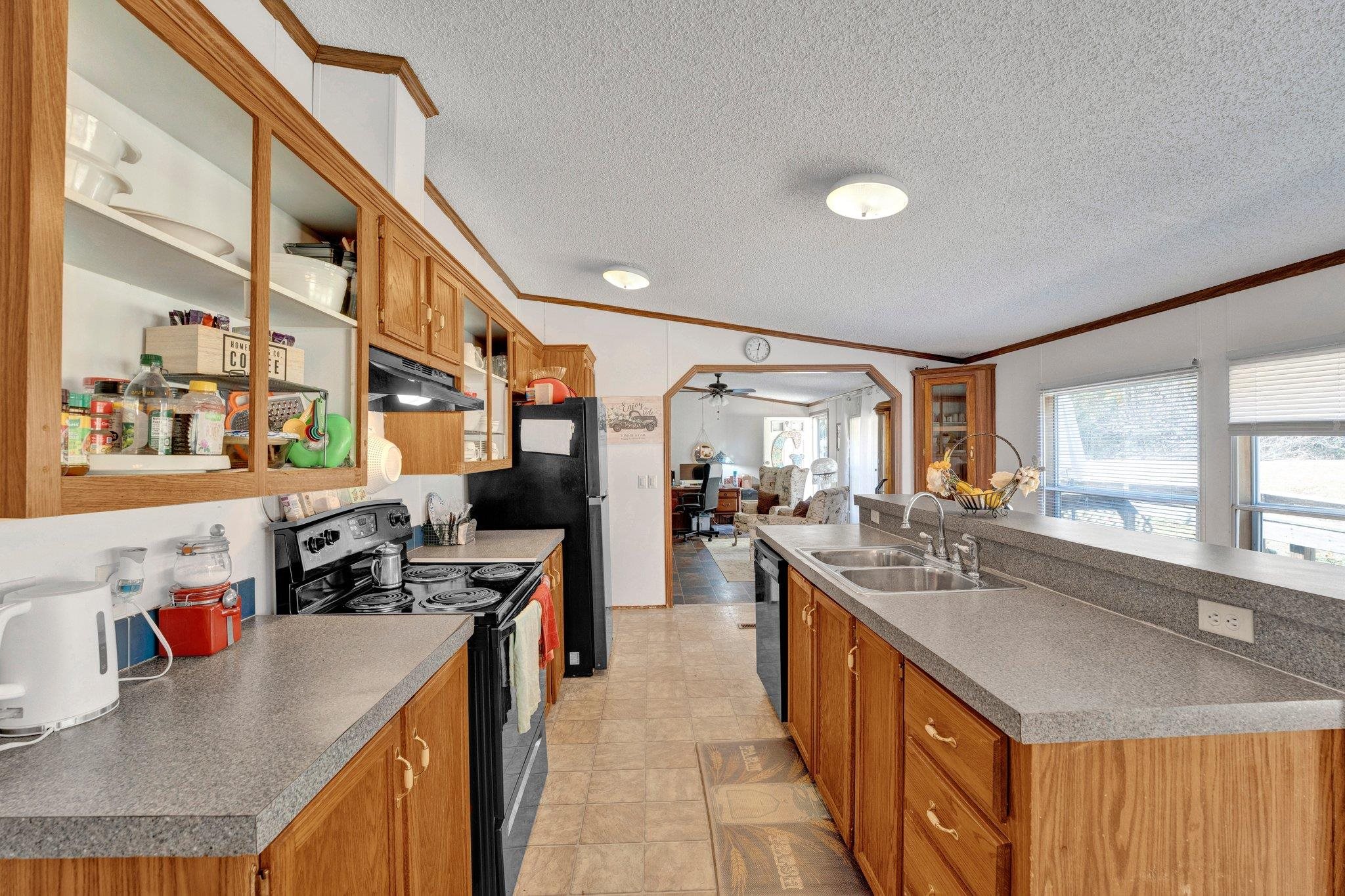 6170 Rust Road Millington, TN 38053 - Photo 12 of 34 a open kitchen with stainless steel appliances granite countertop a sink stove and cabinets