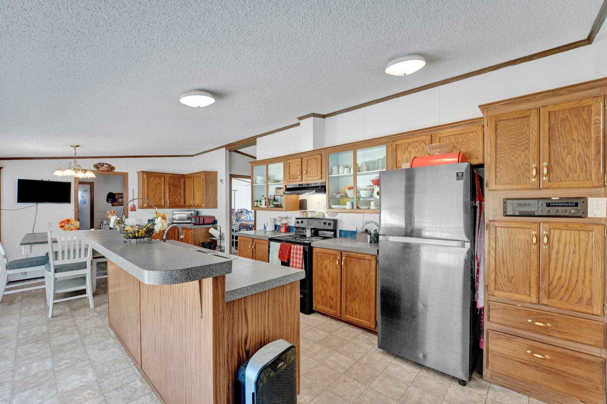 6170 Rust Road Millington, TN 38053 - Photo 15 of 34 a kitchen with refrigerator a stove a sink and a microwave