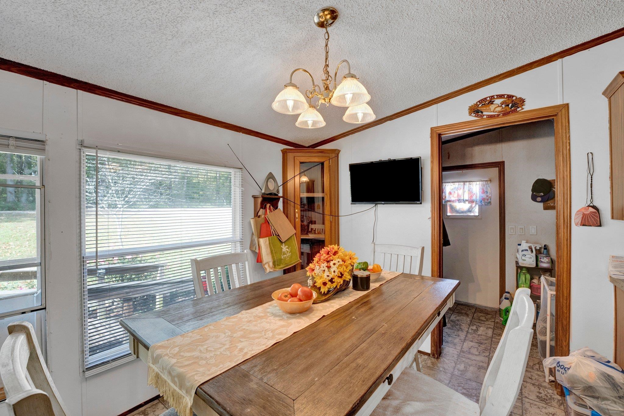 6170 Rust Road Millington, TN 38053 - Photo 20 of 34 a view of a dining room with furniture window and wooden floor