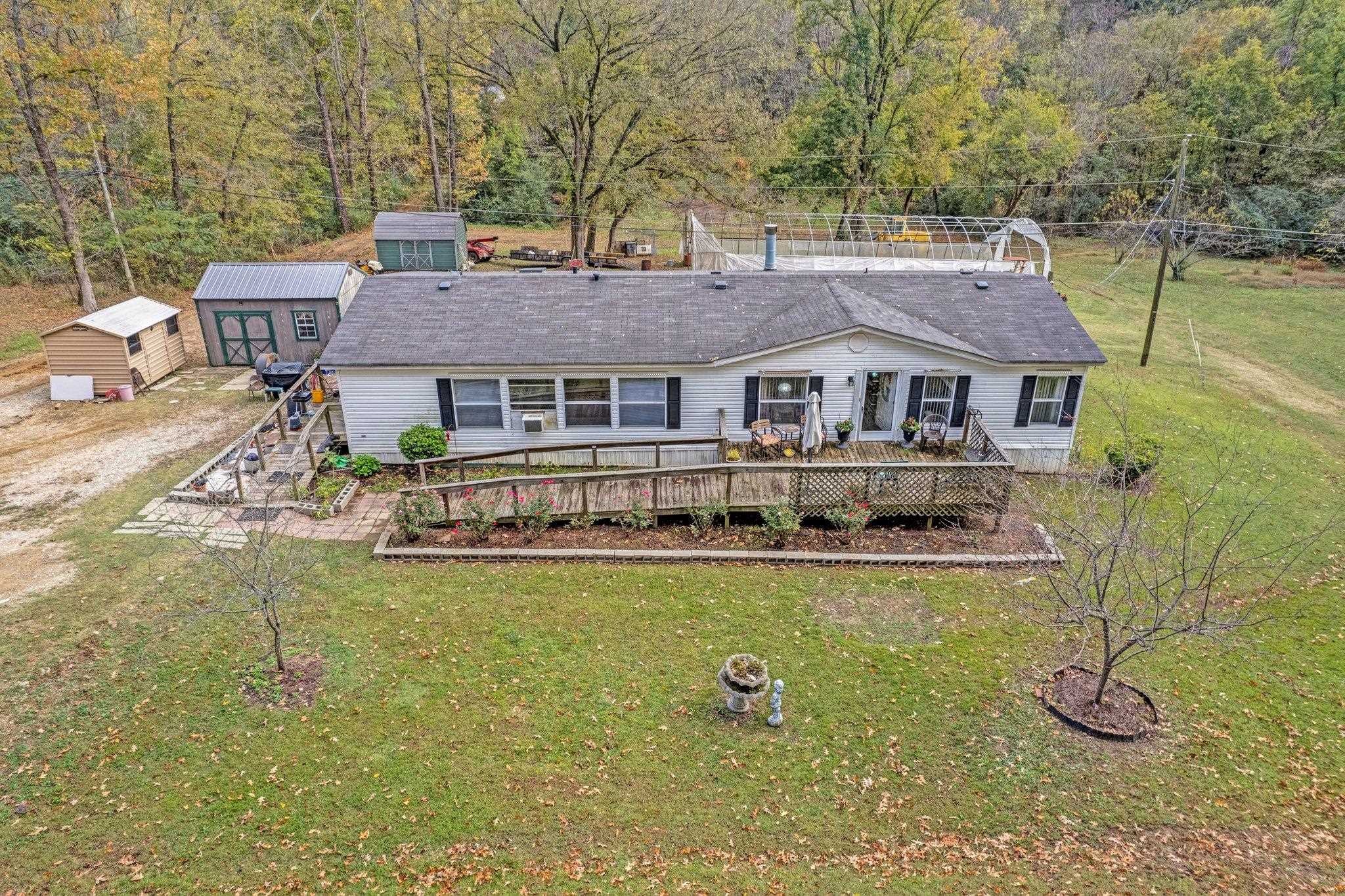6170 Rust Road Millington, TN 38053 - Photo 2 of 34 a front view of a house with swimming pool and porch