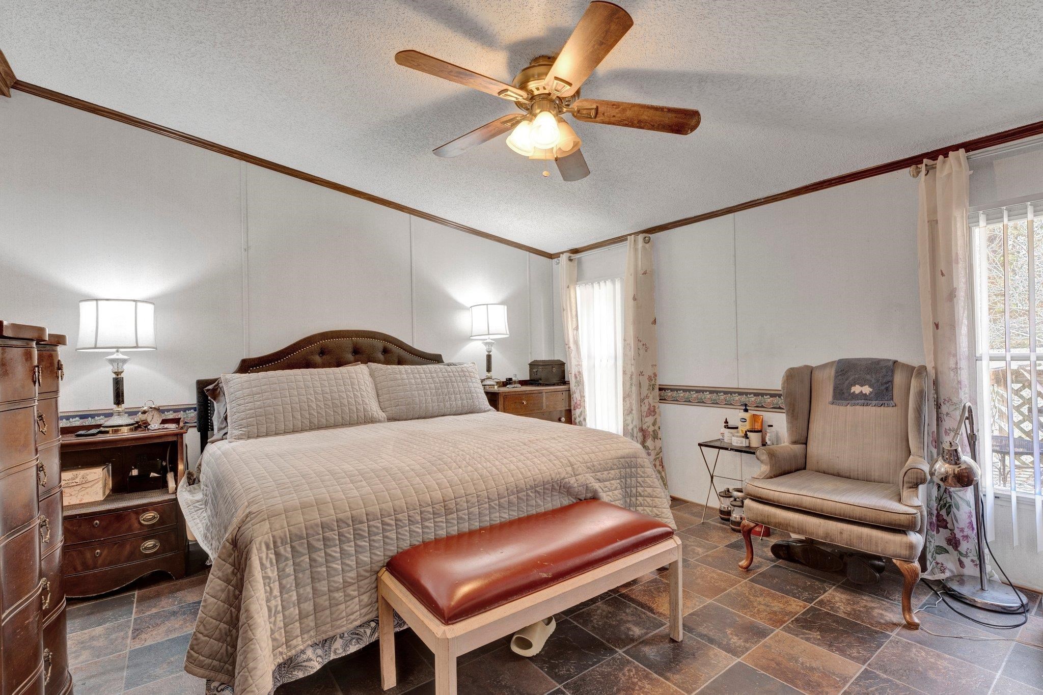 6170 Rust Road Millington, TN 38053 - Photo 22 of 34 a bedroom with a bed and wooden floor