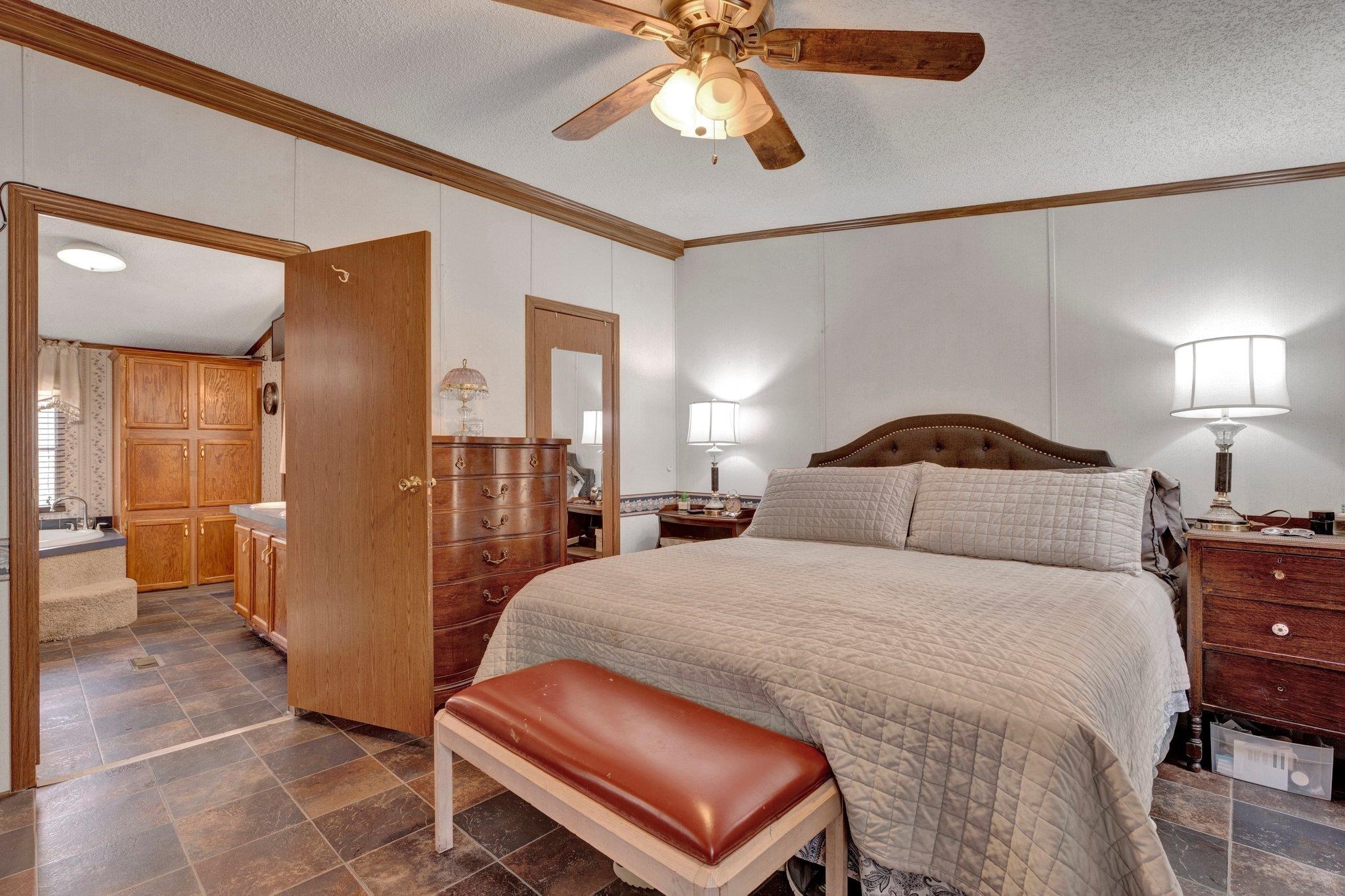 6170 Rust Road Millington, TN 38053 - Photo 23 of 34 a bedroom with a bed and a chandelier