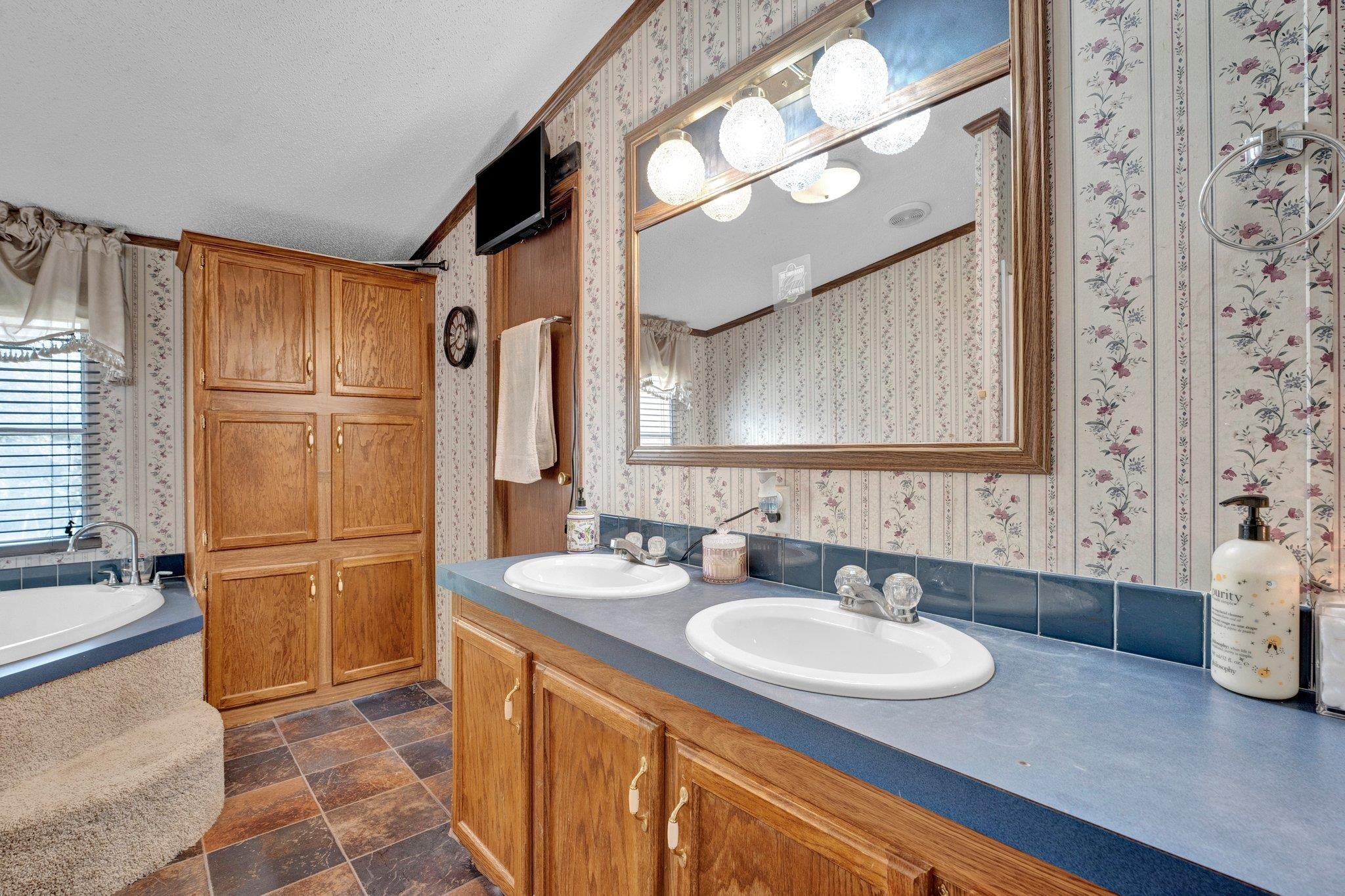 6170 Rust Road Millington, TN 38053 - Photo 26 of 34 a bathroom with a granite countertop sink and a mirror