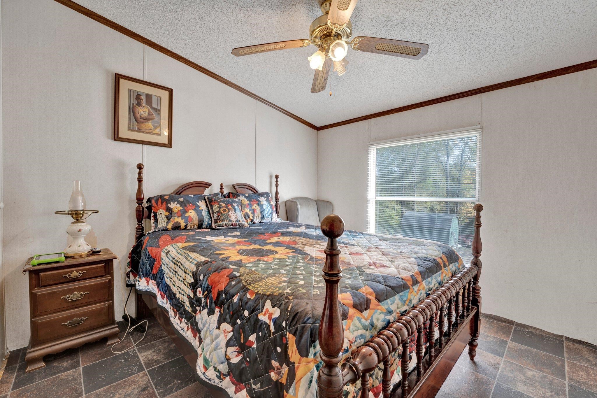 6170 Rust Road Millington, TN 38053 - Photo 27 of 34 a bedroom with a bed and a chandelier
