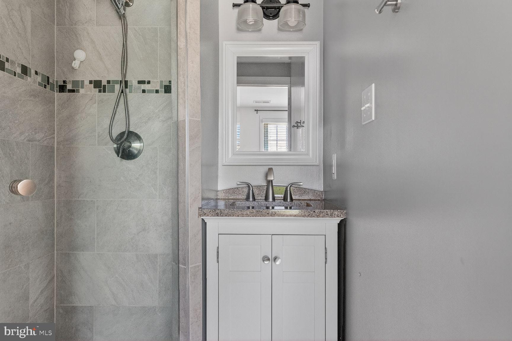 43983 Choptank Terrace Ashburn, VA 20147 - Photo 12 of 21 Sleek modern bathroom retreat.