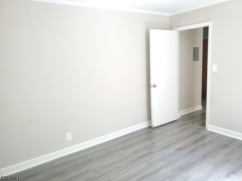 935 East Front Street, Unit C Plainfield, NJ 07062 - Photo 23 of 25 a view of an empty room with wooden floor