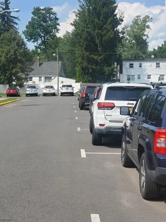 a view of street with parked cars