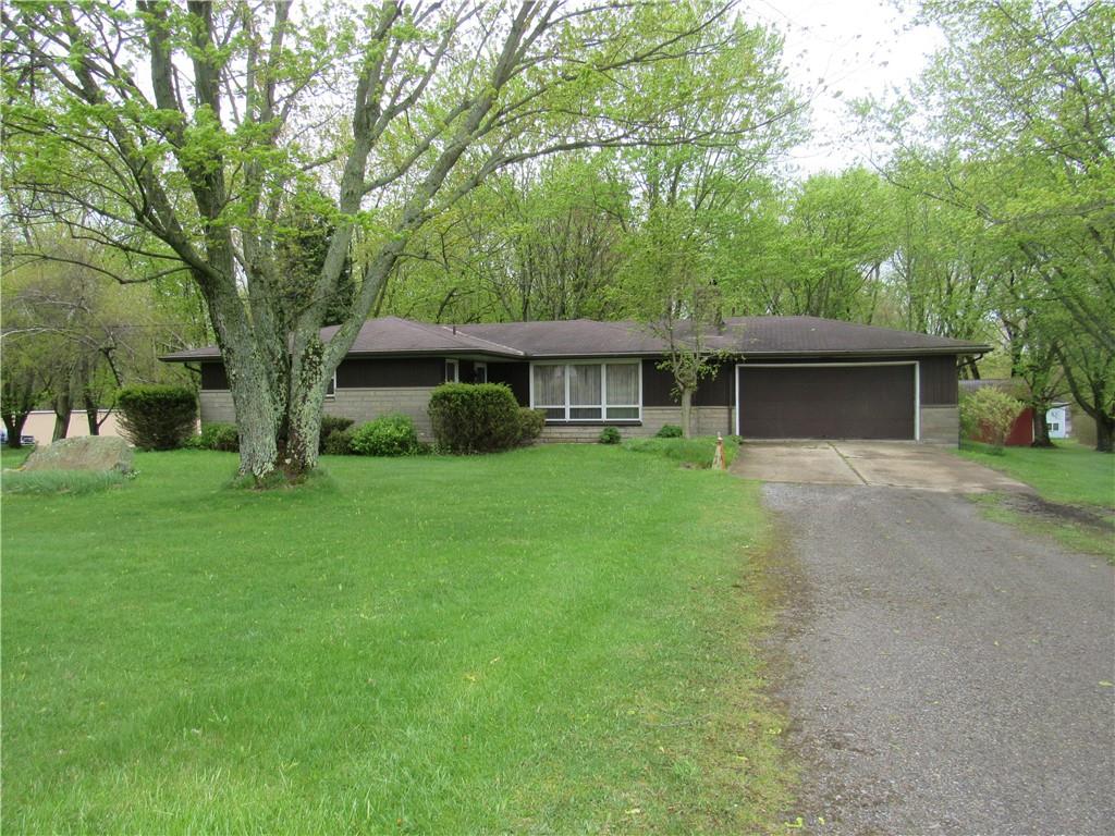 144 Pleasant Hill Road Harmony, PA 16037 - Photo 1 of 31 a front view of a house with garden