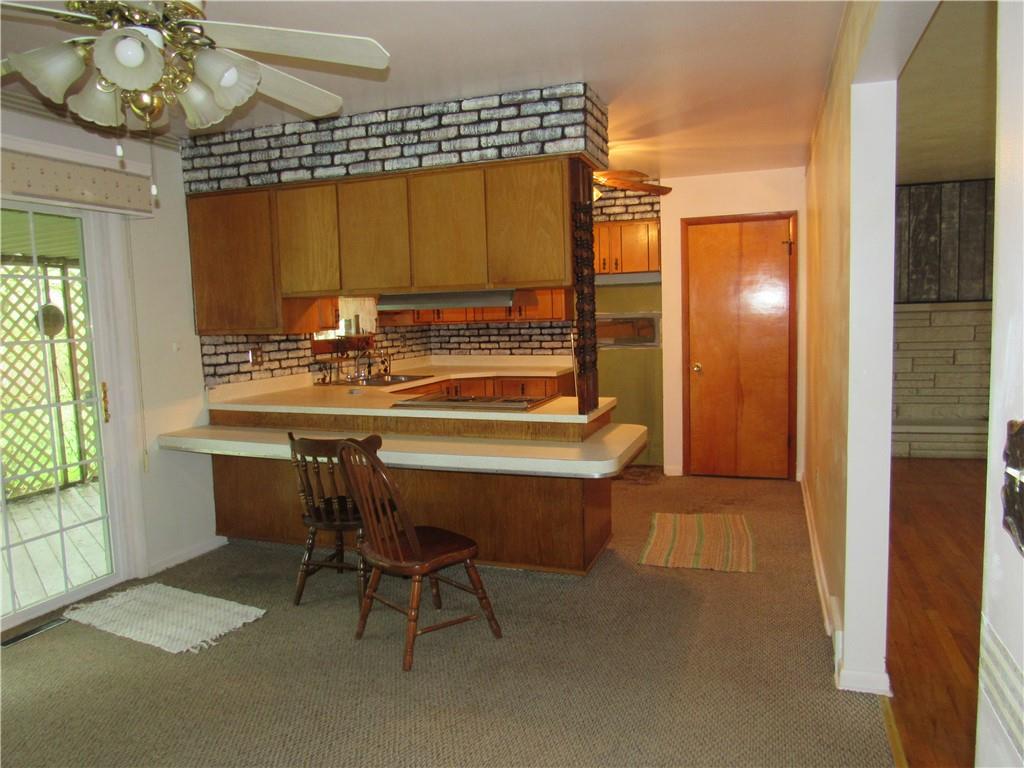 144 Pleasant Hill Road Harmony, PA 16037 - Photo 12 of 31 a dining room with a table and chairs