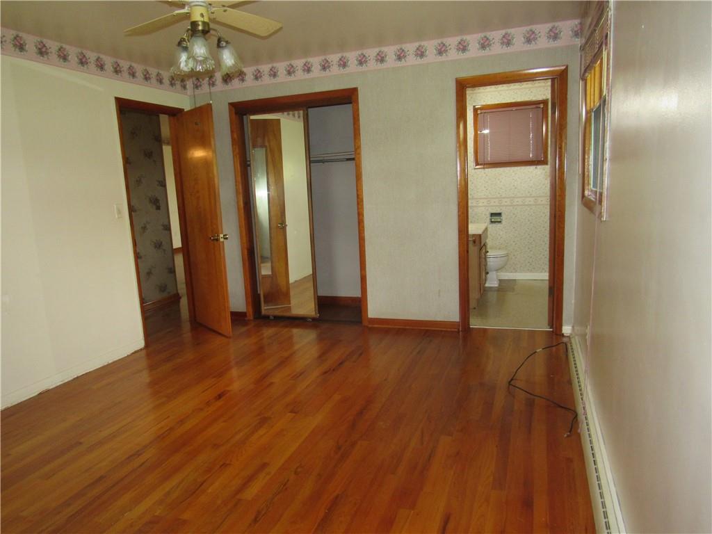 144 Pleasant Hill Road Harmony, PA 16037 - Photo 14 of 31 a view of a room with wooden floor and staircase