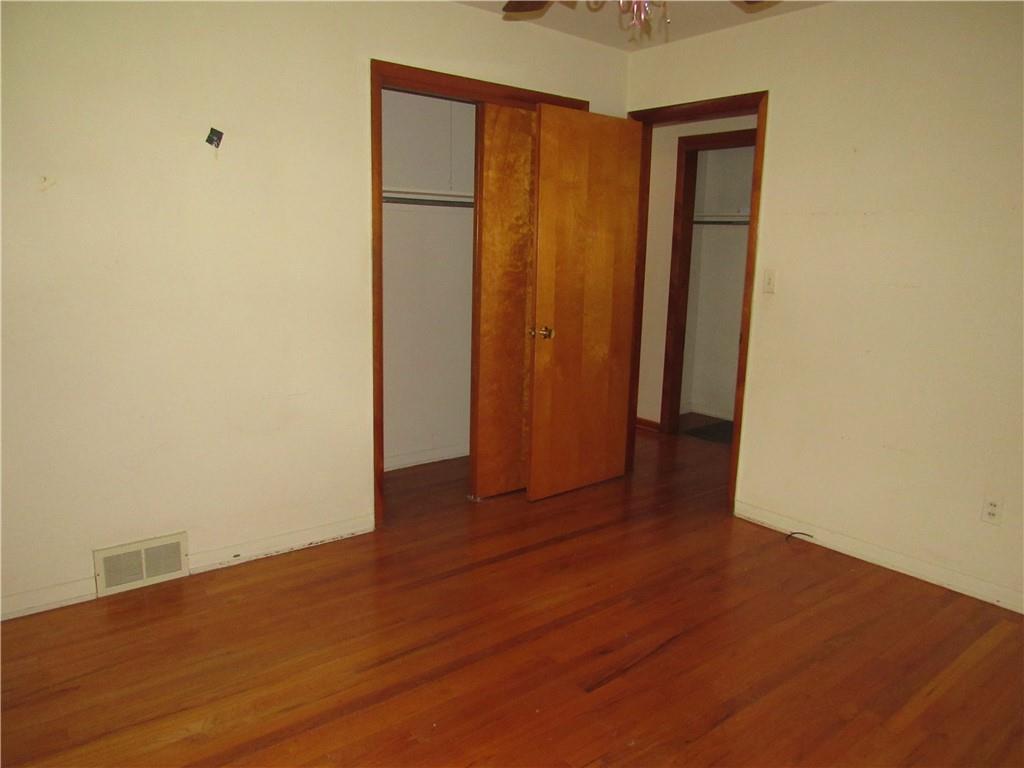 144 Pleasant Hill Road Harmony, PA 16037 - Photo 15 of 31 an empty room with wooden floor and closet