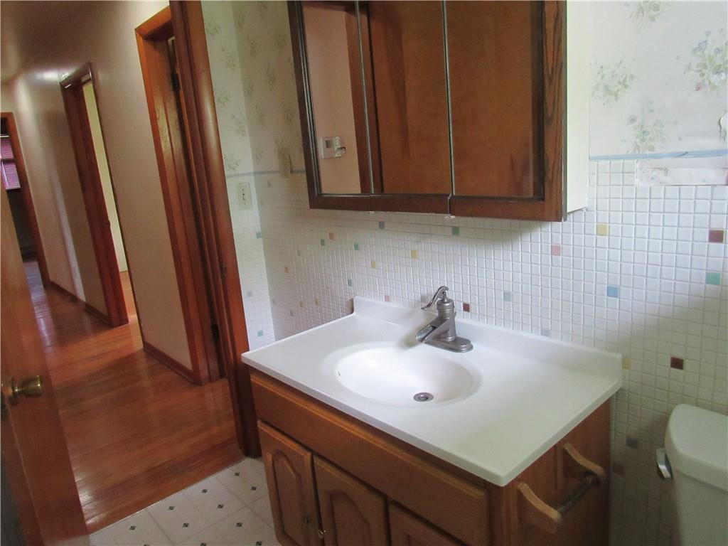 144 Pleasant Hill Road Harmony, PA 16037 - Photo 18 of 31 a bathroom with a sink a toilet and a mirror