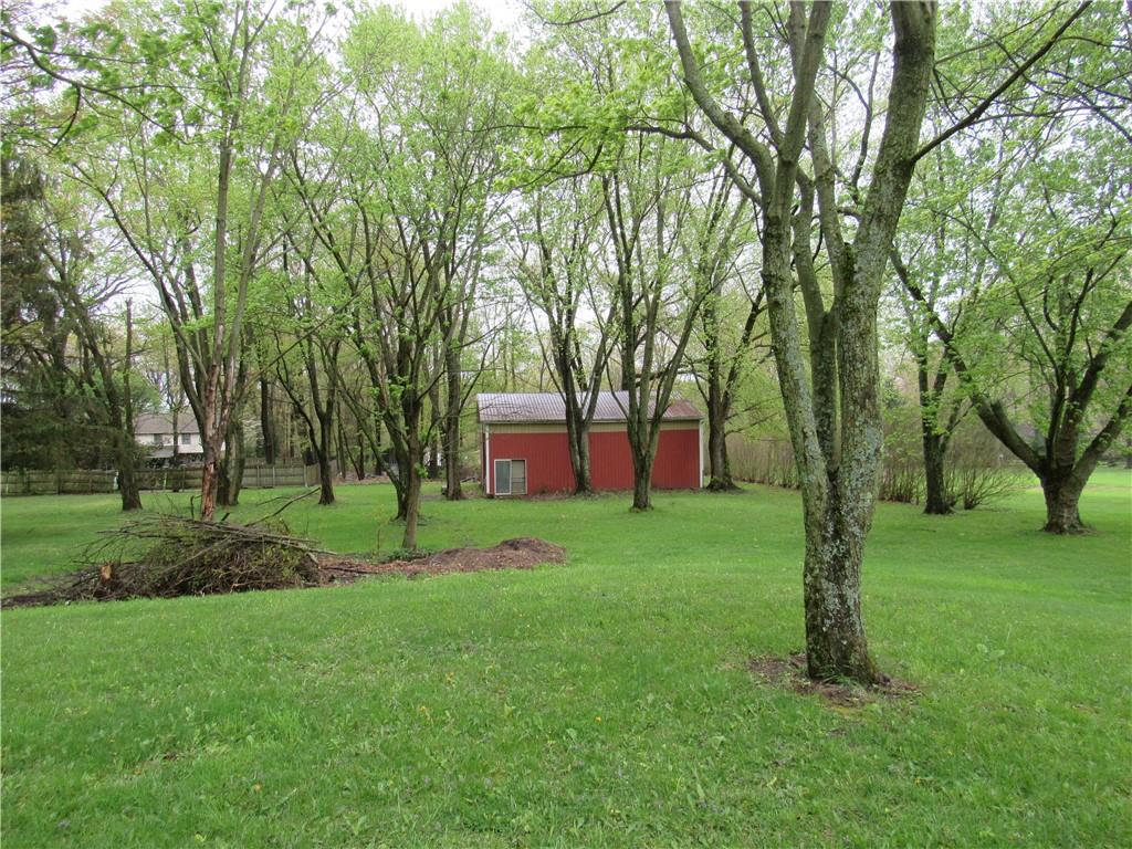 144 Pleasant Hill Road Harmony, PA 16037 - Photo 29 of 31 a view of a backyard with large trees