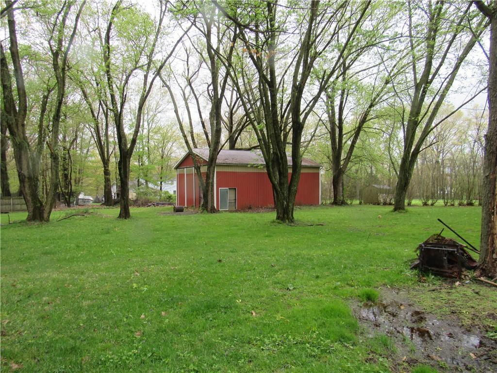 144 Pleasant Hill Road Harmony, PA 16037 - Photo 30 of 31 a view of a backyard with large trees