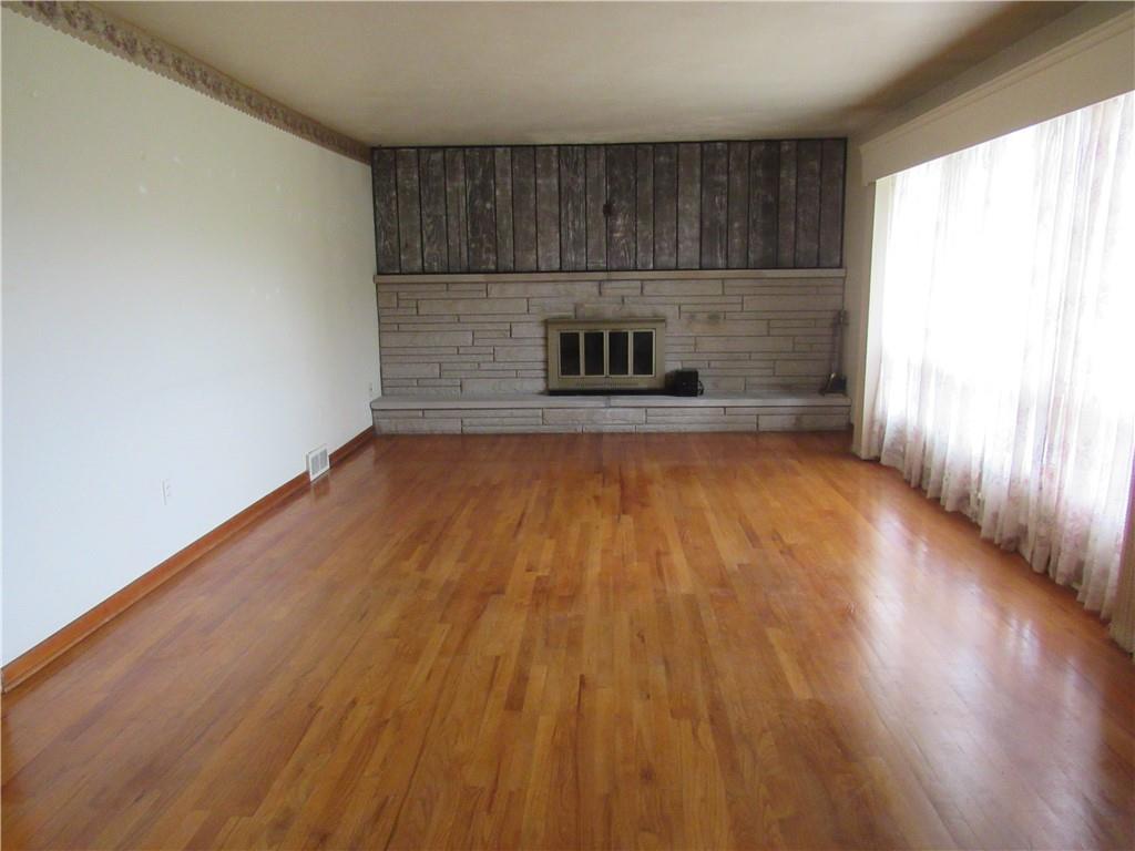 144 Pleasant Hill Road Harmony, PA 16037 - Photo 6 of 31 a view of a kitchen with wooden floor and a sink
