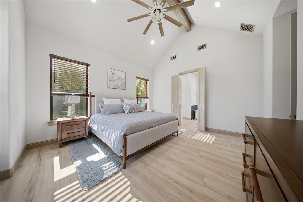 958 Cedar Mills Road Gordonville, TX 76245 - Photo 16 of 40 a bedroom with a bed and wooden floor