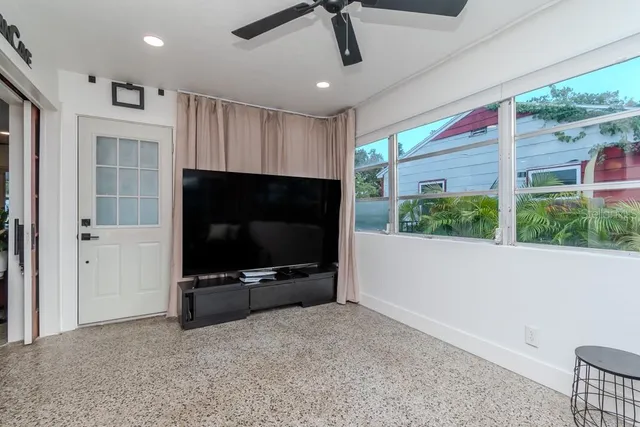 a bathroom with a sink mirror and toilet