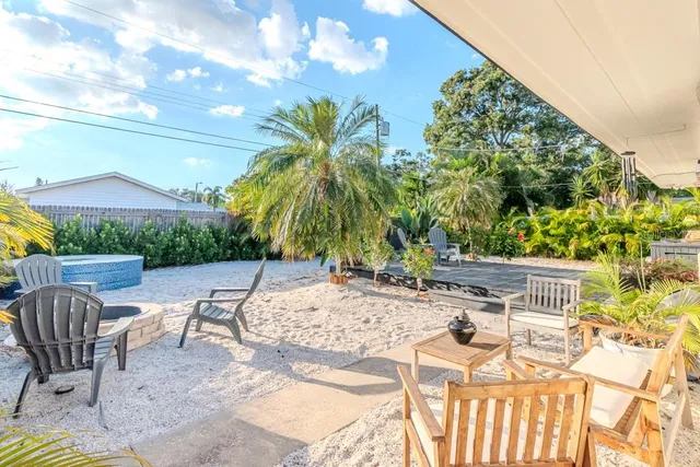 a potted plant sitting in front of a house