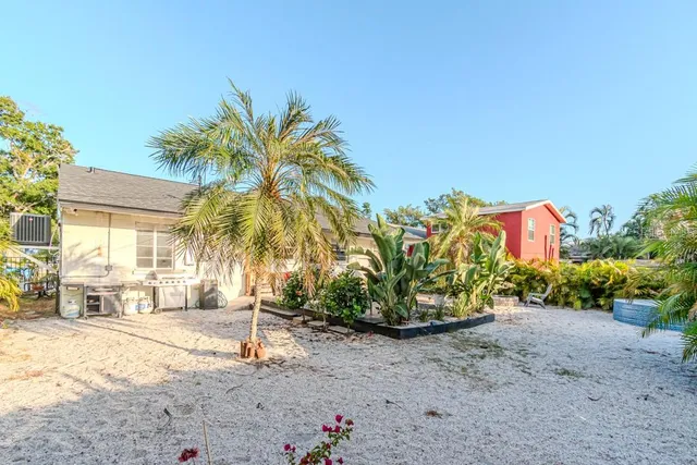 a front view of multi story residential apartment building with retail shops