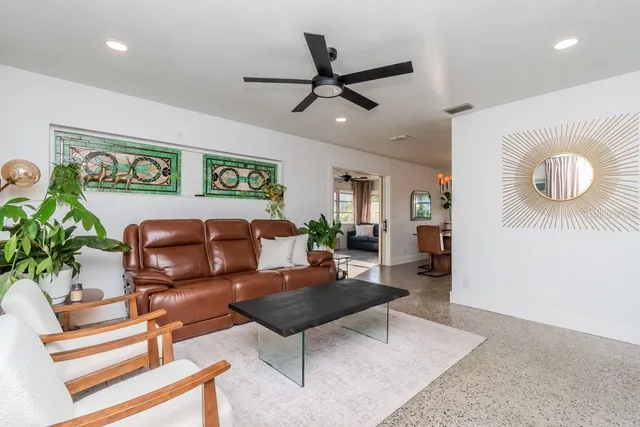 a living room with furniture and a rug