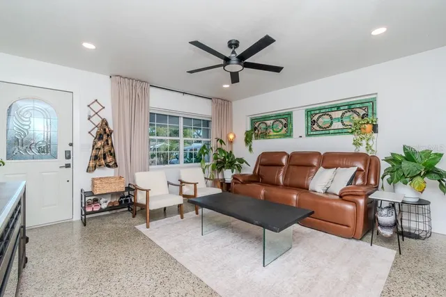 a living room with furniture and a large window