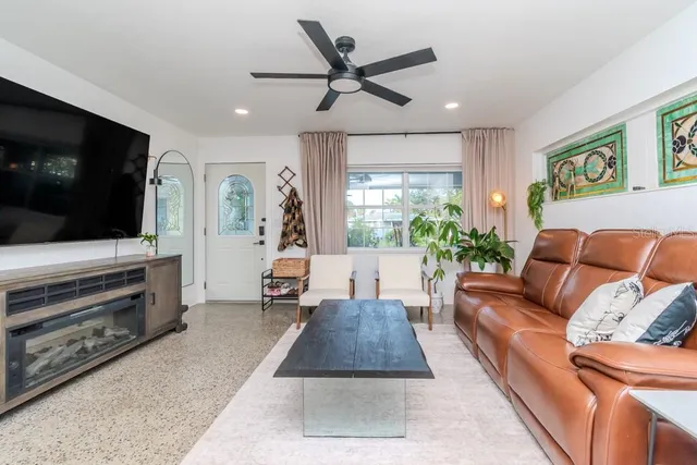 a living room with furniture and a flat screen tv
