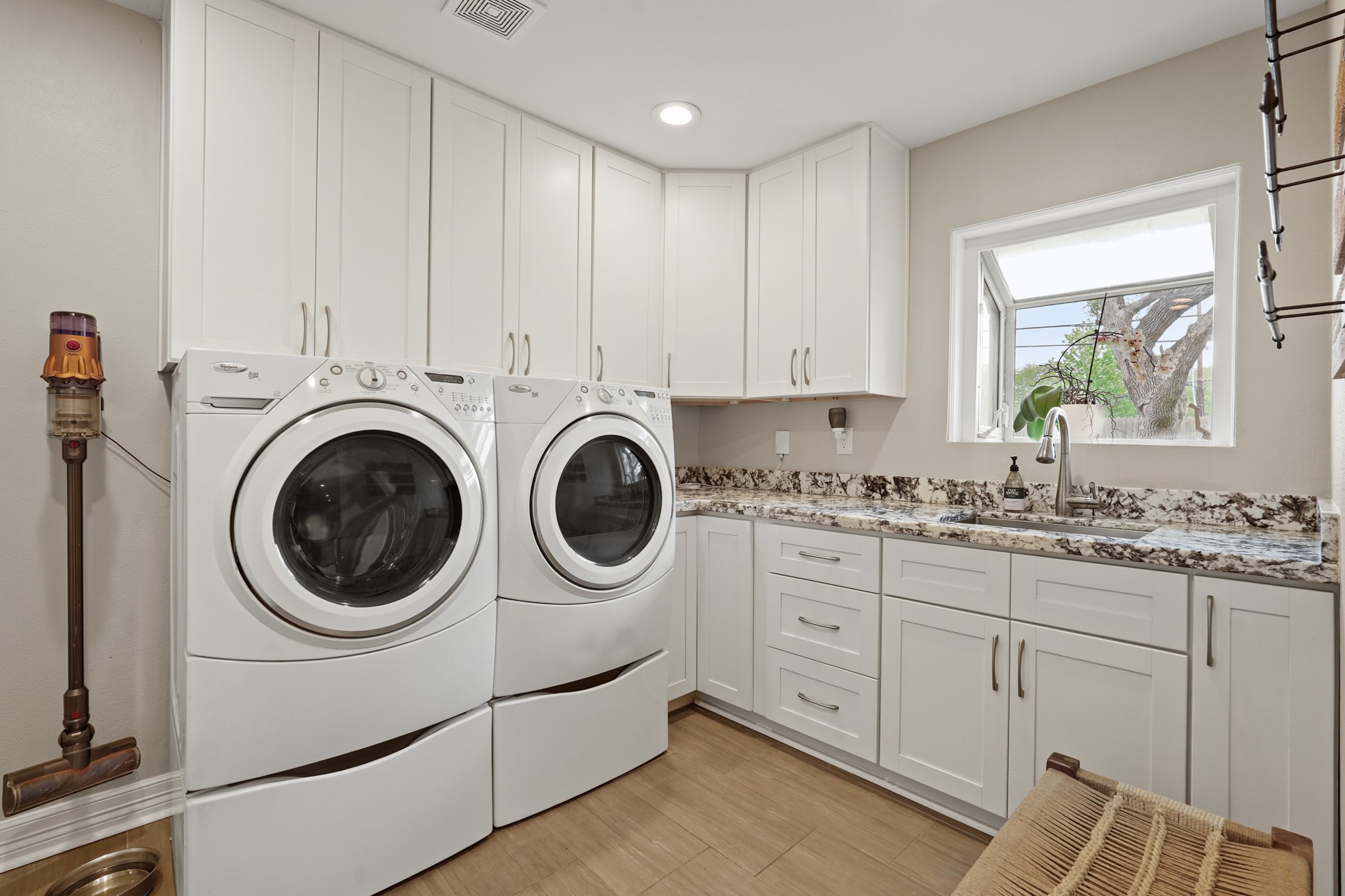 5242 Sanford Road Houston, TX 77035 - Photo 27 of 34 Indoor utility room complete with a beautiful countertop, sink, and plenty of storage. Light, bright, and a rare find for this neighborhood beauty!