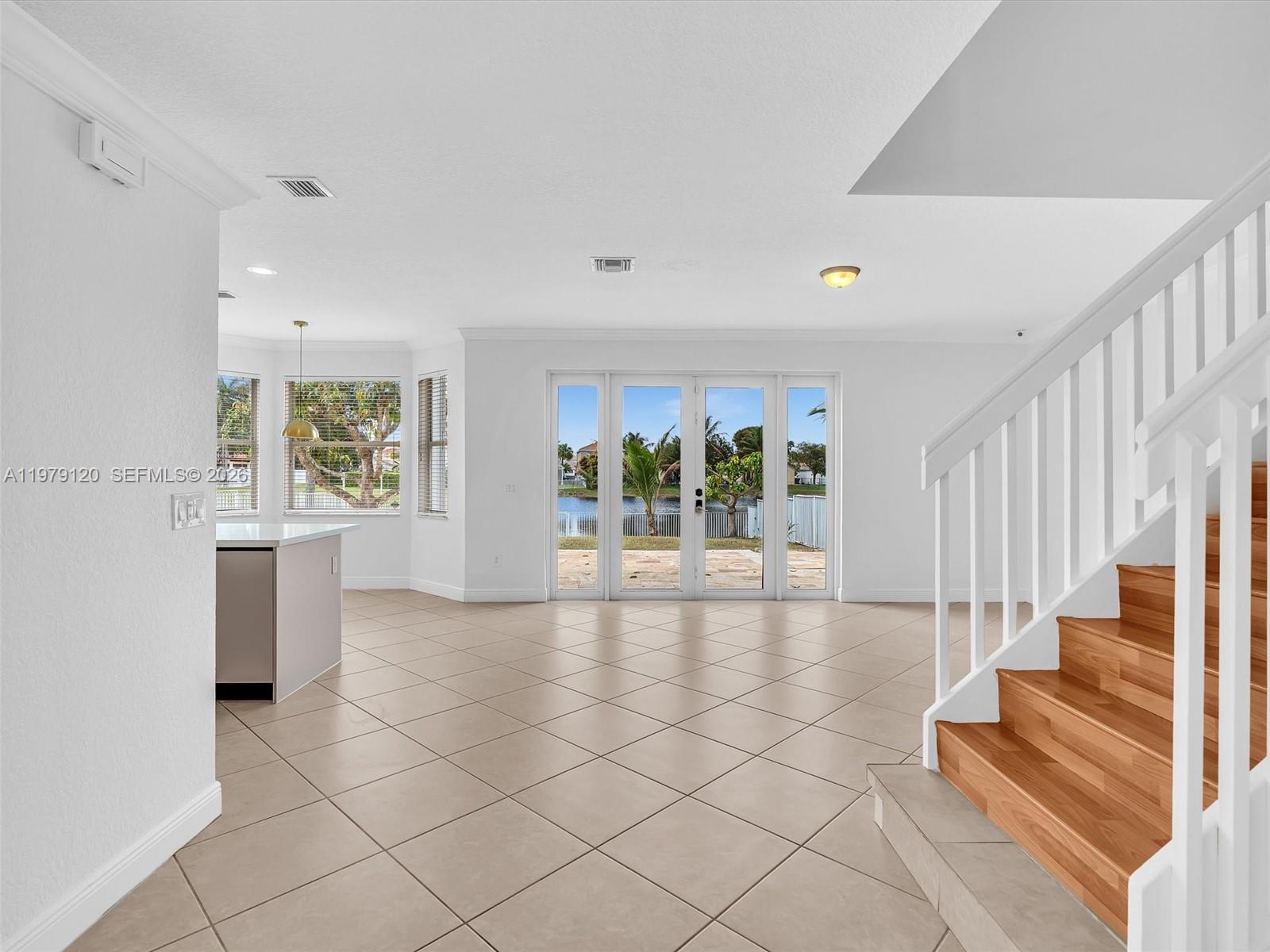 15363 Northwest 14th Road Pembroke Pines, FL 33028 - Photo 17 of 71 a view of an entryway with wooden floor and windows