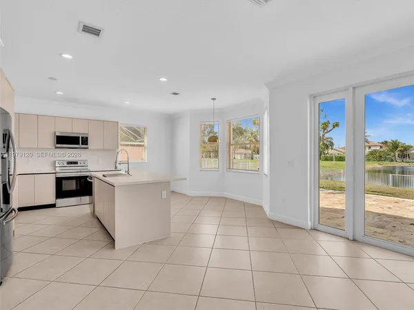 a view of an entryway with wooden floor