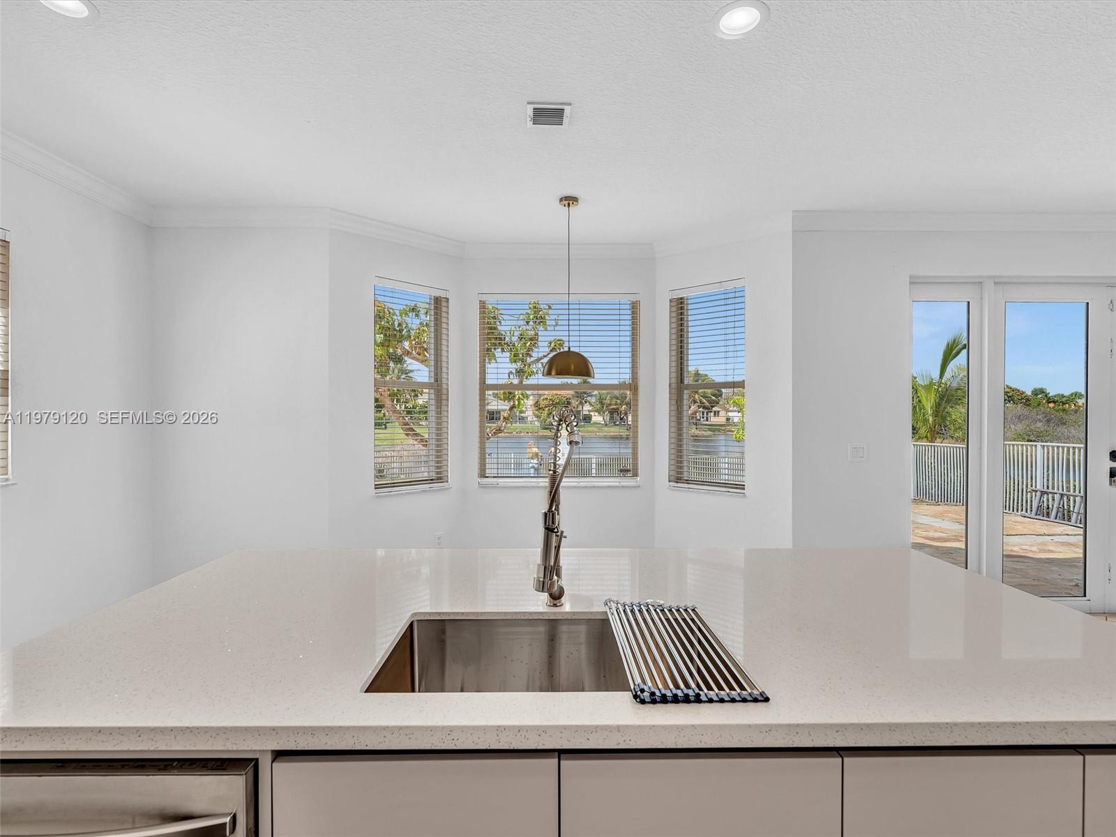 15363 Northwest 14th Road Pembroke Pines, FL 33028 - Photo 30 of 71 a kitchen with a sink and a window