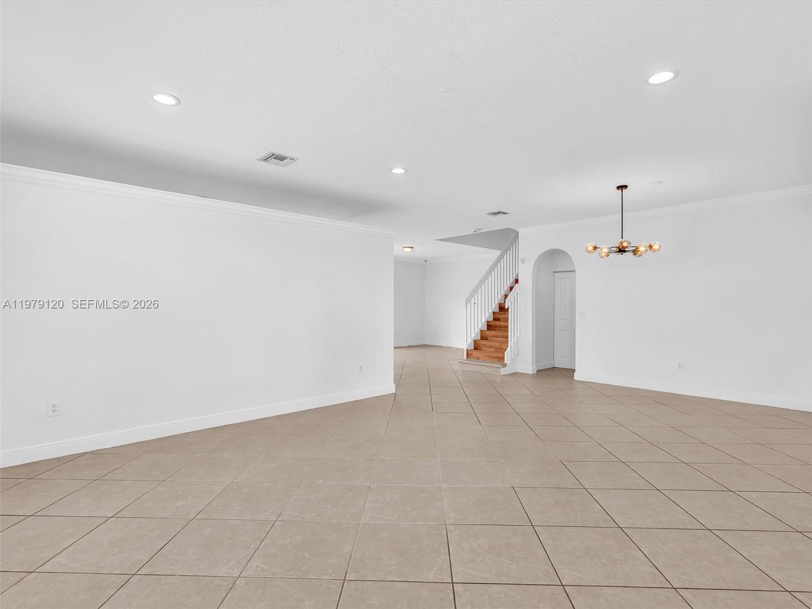 15363 Northwest 14th Road Pembroke Pines, FL 33028 - Photo 33 of 71 an empty room with staircase and ceiling fan