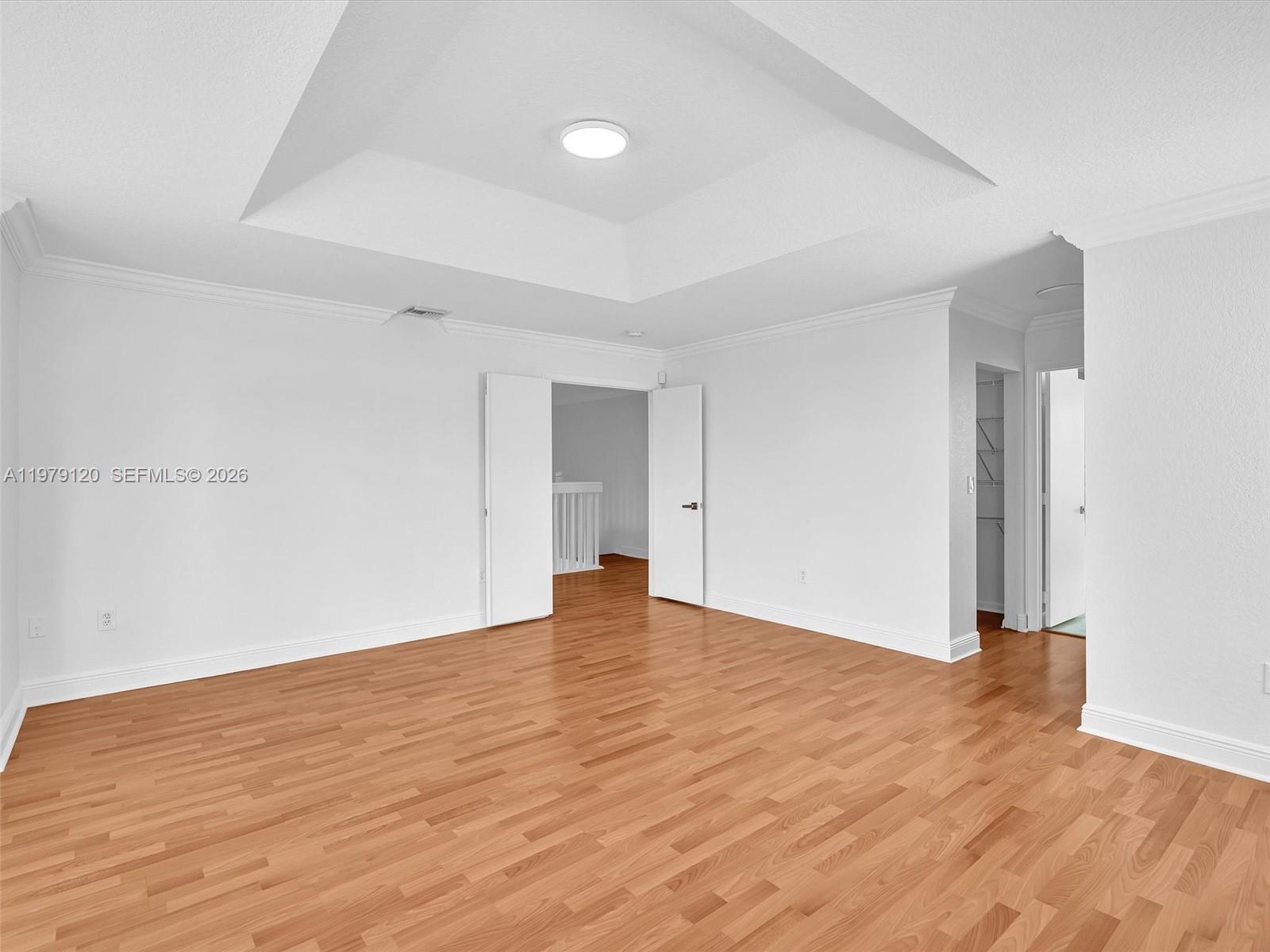 15363 Northwest 14th Road Pembroke Pines, FL 33028 - Photo 37 of 71 a view of an empty room with wooden floor and a window