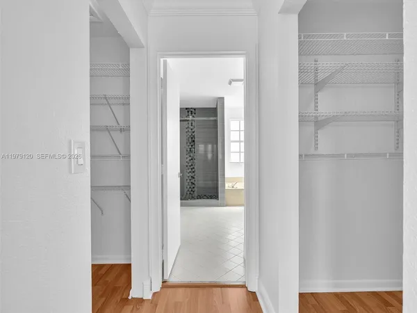 a view of a room with wooden floor