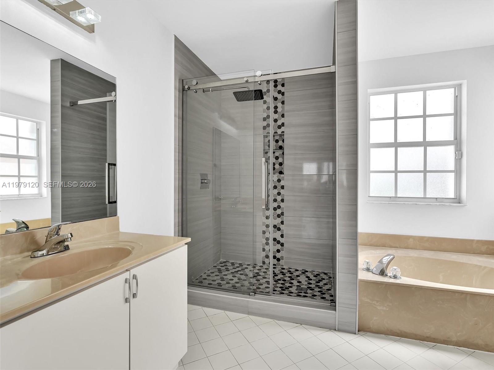 15363 Northwest 14th Road Pembroke Pines, FL 33028 - Photo 40 of 71 a bathroom with a bathtub a shower and a sink