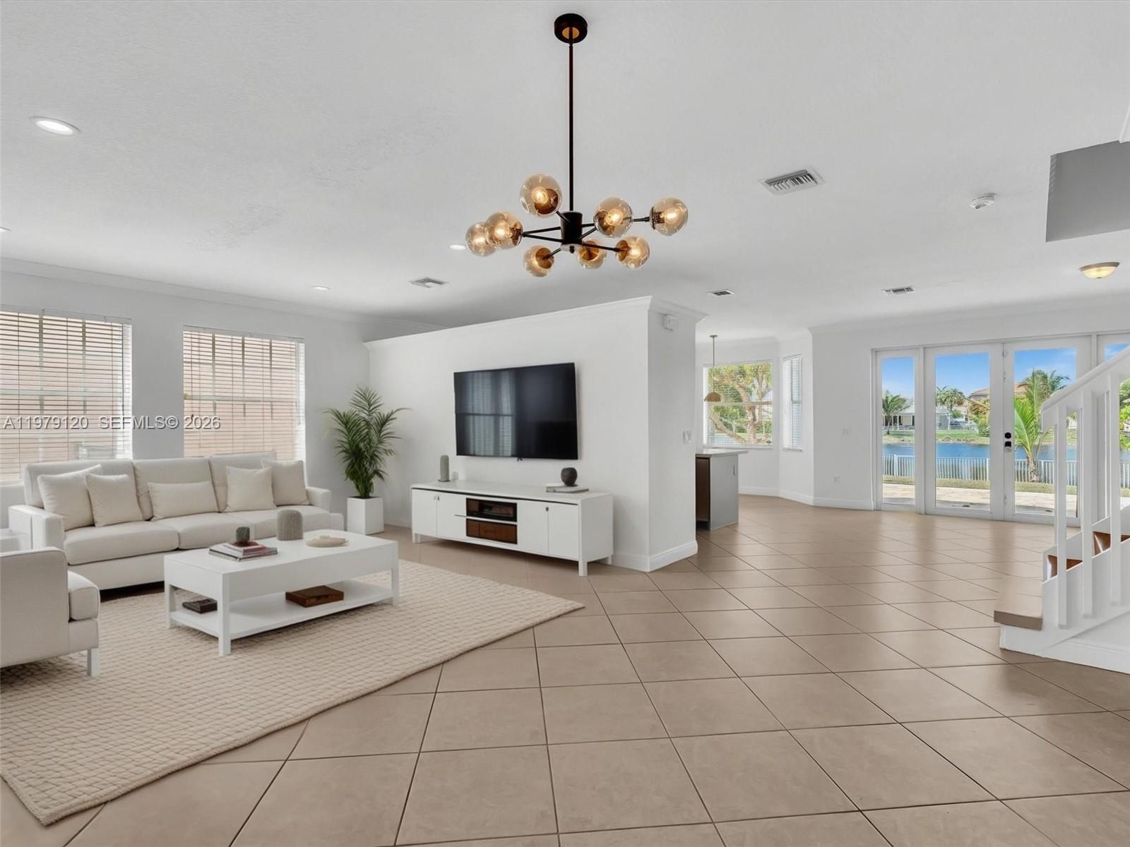 15363 Northwest 14th Road Pembroke Pines, FL 33028 - Photo 4 of 71 a living room with furniture and a flat screen tv