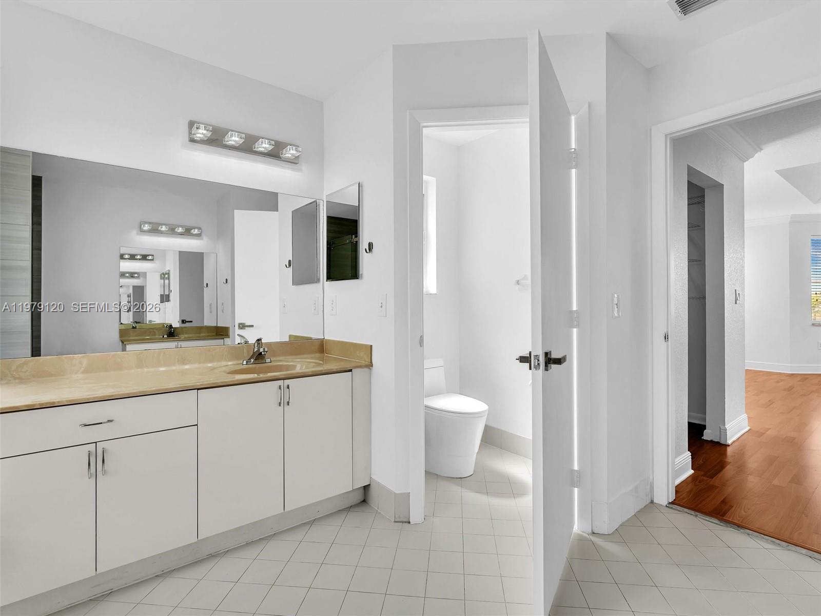 15363 Northwest 14th Road Pembroke Pines, FL 33028 - Photo 41 of 71 a spacious bathroom with a granite countertop sink mirror and toilet