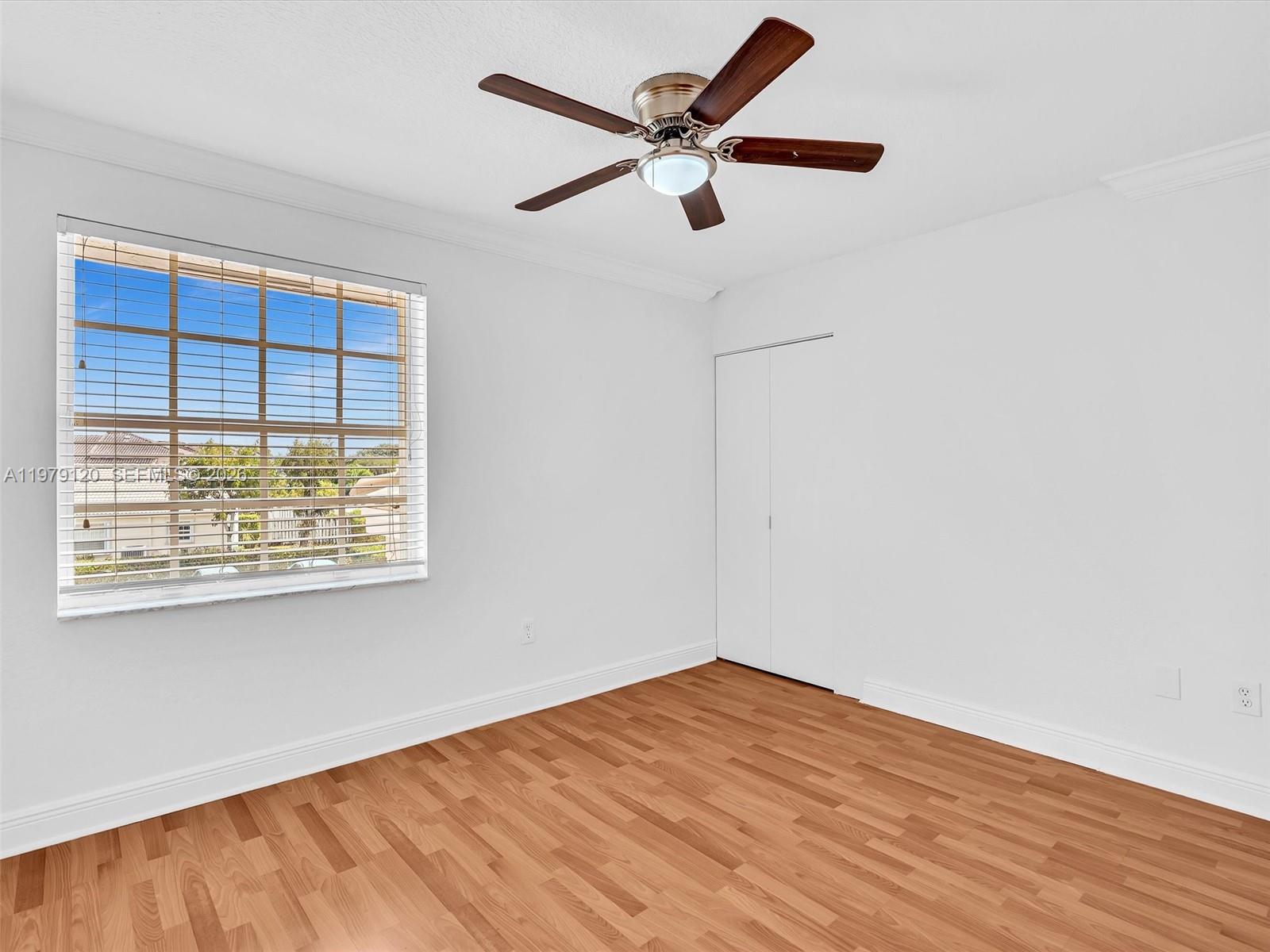 15363 Northwest 14th Road Pembroke Pines, FL 33028 - Photo 42 of 71 a view of empty room with wooden floor and fan