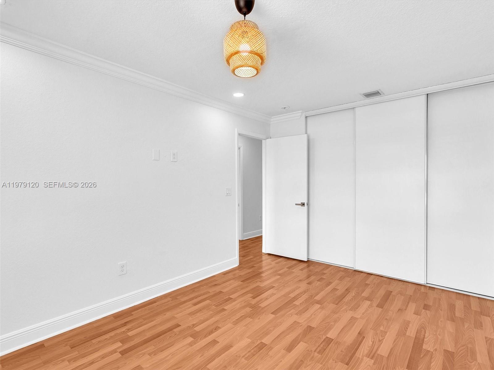 15363 Northwest 14th Road Pembroke Pines, FL 33028 - Photo 46 of 71 a view of an empty room with wooden floor