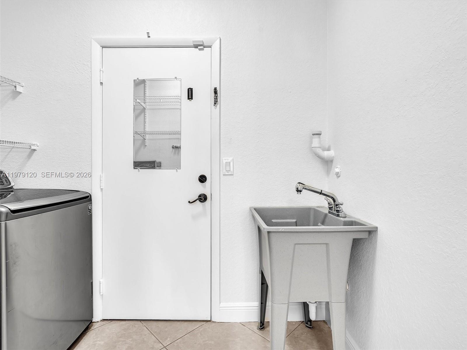 15363 Northwest 14th Road Pembroke Pines, FL 33028 - Photo 52 of 71 a bathroom with a sink and a mirror