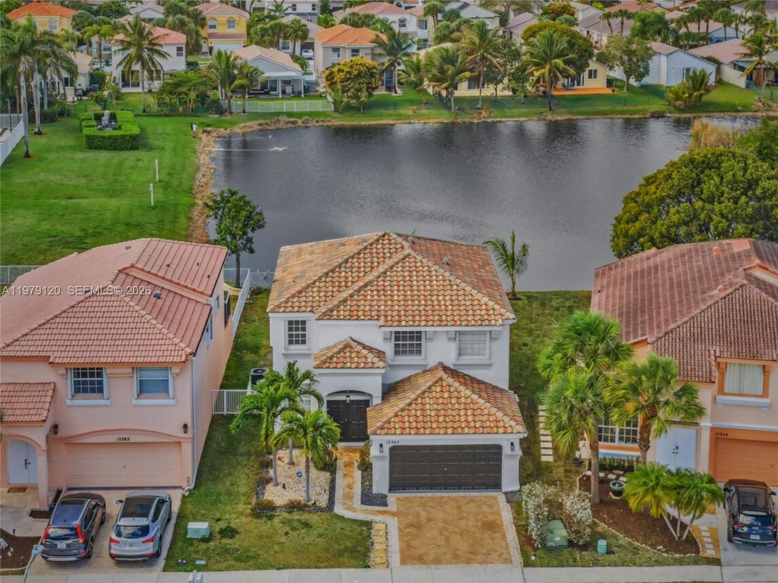 15363 Northwest 14th Road Pembroke Pines, FL 33028 - Photo 53 of 71 an aerial view of a house with a lake view