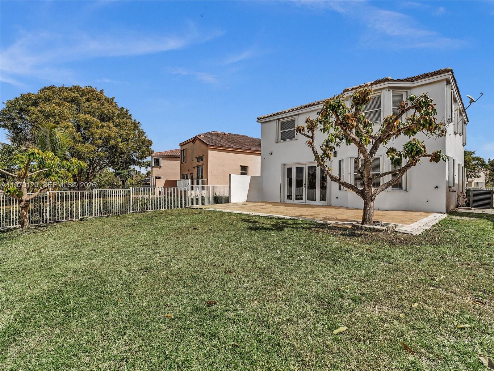 15363 Northwest 14th Road Pembroke Pines, FL 33028 - Photo 56 of 71 a view of a house with backyard and trees