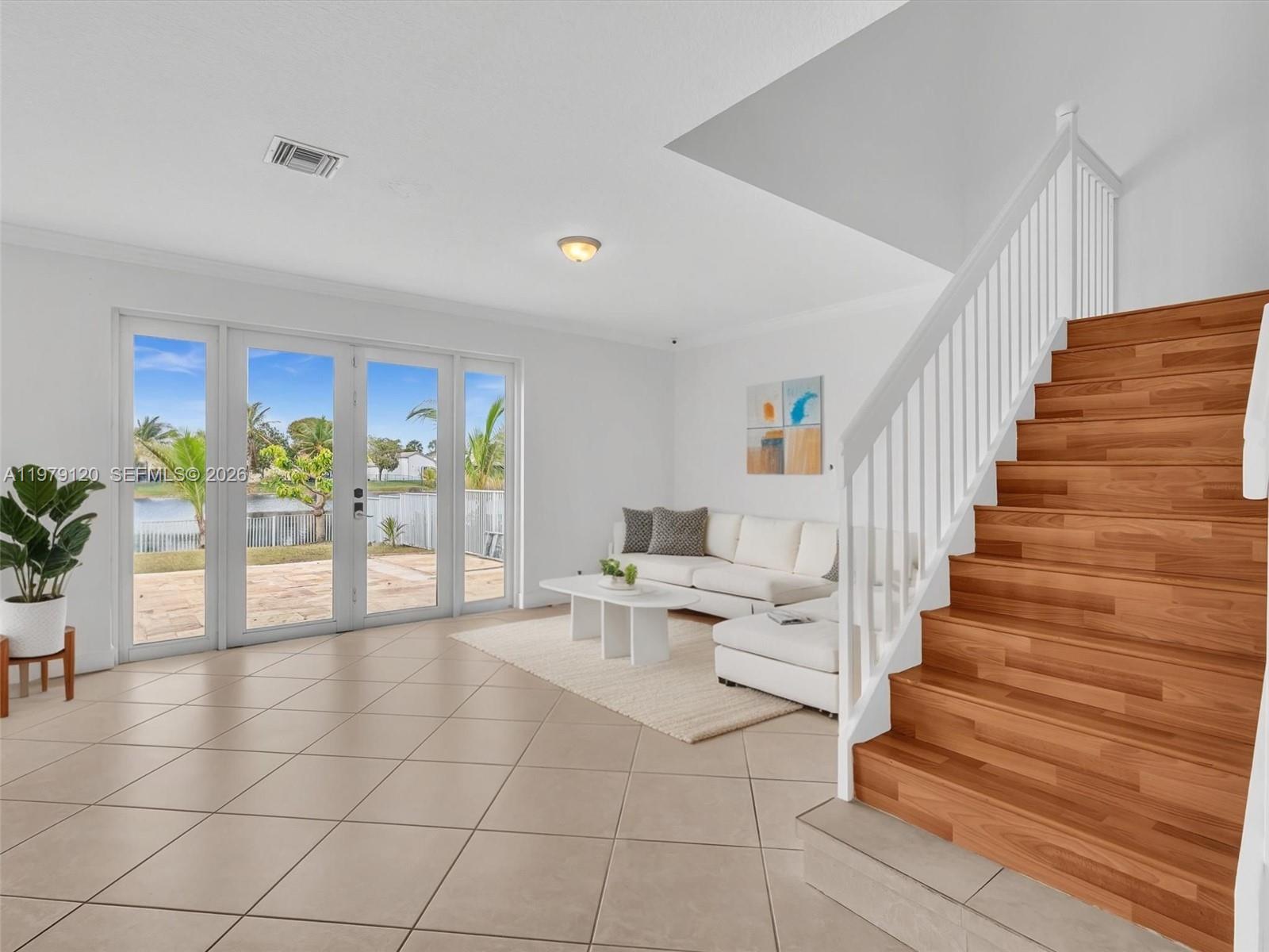 15363 Northwest 14th Road Pembroke Pines, FL 33028 - Photo 6 of 71 a view of entryway and hall with wooden floor
