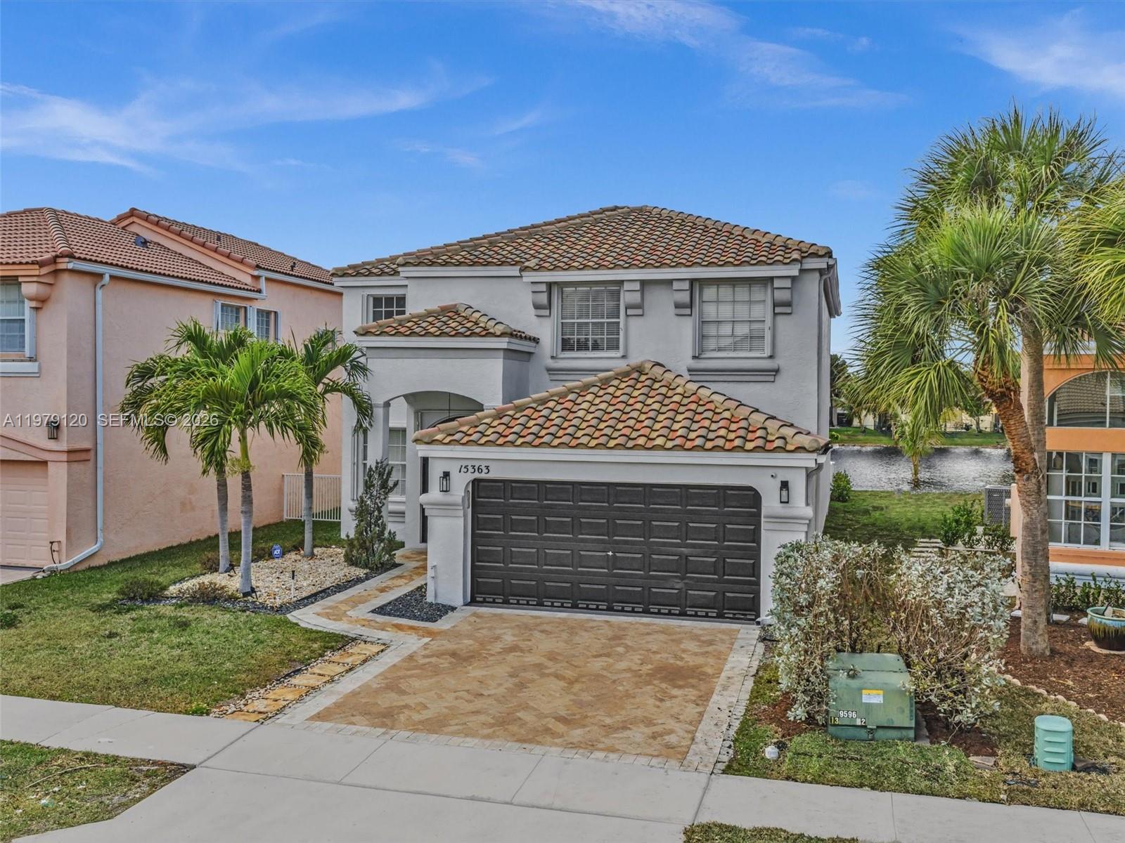 15363 Northwest 14th Road Pembroke Pines, FL 33028 - Photo 71 of 71 front view of a house with a yard