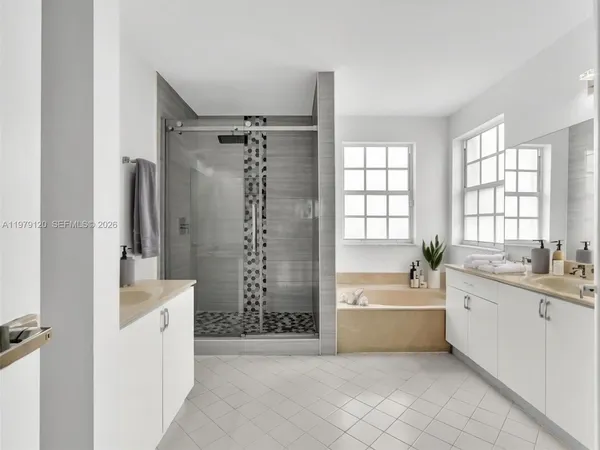 a bedroom with bed and a window