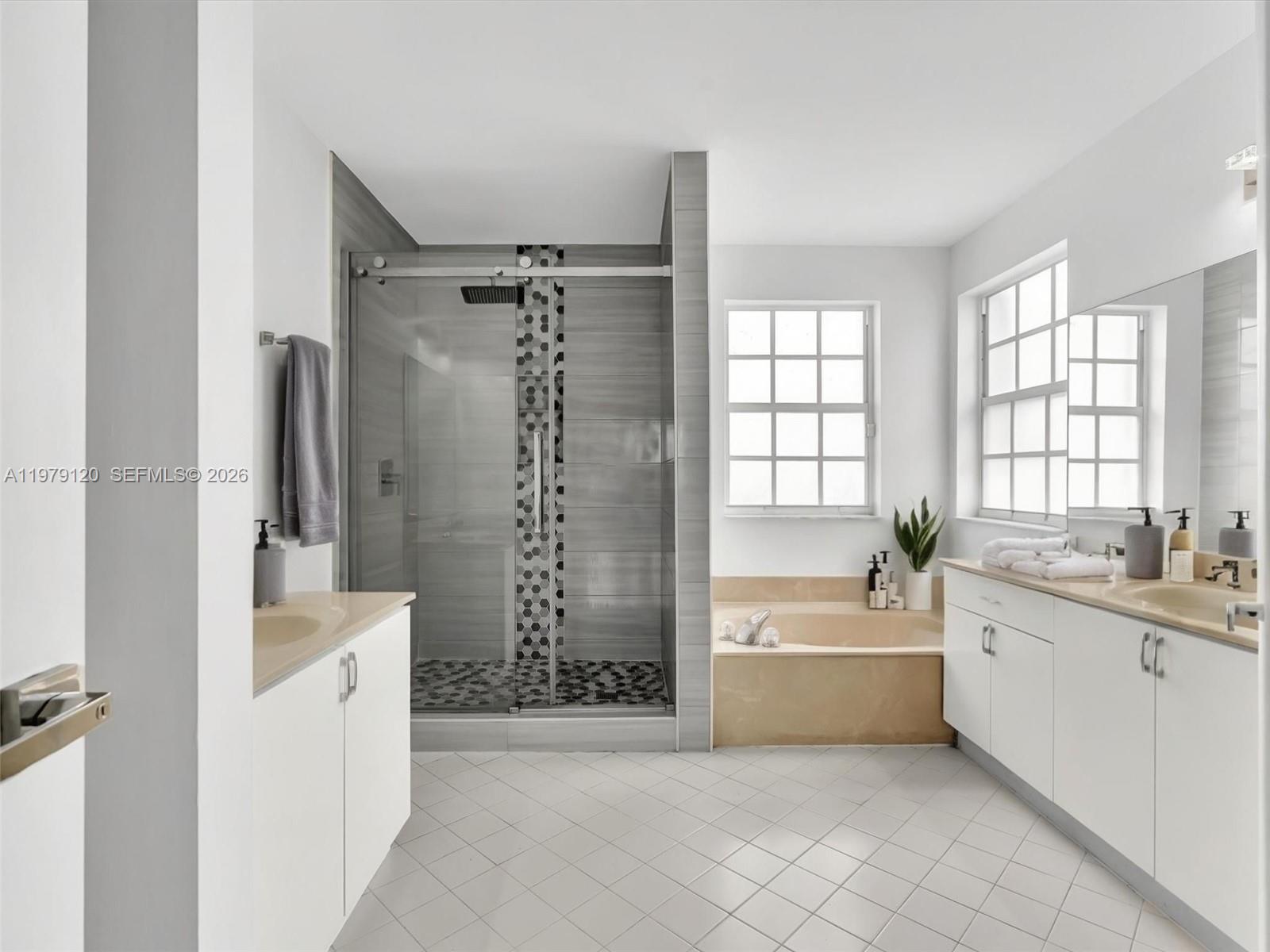 15363 Northwest 14th Road Pembroke Pines, FL 33028 - Photo 10 of 71 a bathroom with a tub sink and mirror